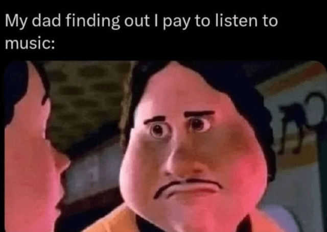 The image is a meme featuring a screenshot from an animated work with overlaid text. At the top, the text reads: 'My dad finding out I pay to listen to music:'. Below the text, there are two animated characters: one (presumed to be the dad) with a shocked, disapproving expression—furrowed brows, a frown, and wide eyes—facing another character (likely his child). The dad's posture suggests confrontation, emphasizing a generational clash over modern music consumption habits (paying for streaming services vs. older methods like physical media or free radio).