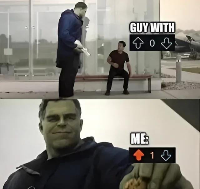 This two-panel meme jokes about Reddit's upvote/downvote system, framing the trivial act of upvoting your own post to get the first upvote as a massive victorious achievement. The top panel shows a large man holding a gun standing in front of an alarmed seated man, labeled 'GUY WITH ↑ 0 ↓', representing the poster when their new post has zero upvotes. The bottom panel is a close-up smug selfie of the same large man, labeled 'ME: ↑ 1 ↓', showing the poster has now upvoted their own post to get one upvote, acting like this small win makes him feel like god.