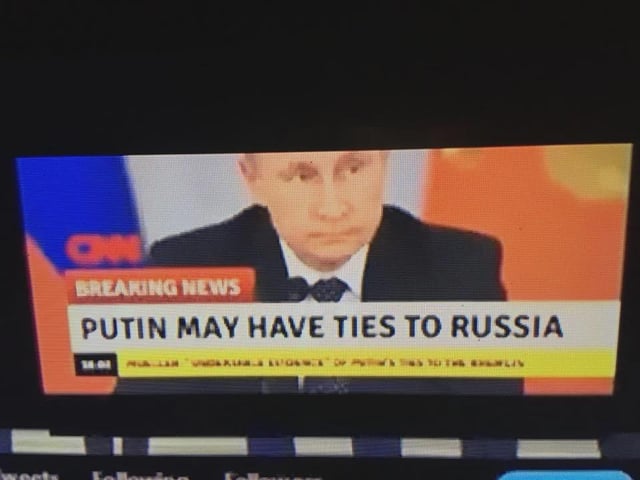 This is a satirical meme showing an edited photo of a CNN breaking news segment. The segment displays an image of Russian president Vladimir Putin, with a sensationalized headline reading "PUTIN MAY HAVE TIES TO RUSSIA". The joke relies on the extreme obviousness of this fact, as Putin is the long-serving head of state of Russia, making the headline pointlessly redundant and absurd when presented as a groundbreaking breaking news revelation. The meme's title frames this uselessly obvious statement as a major helpful lead for the FBI, leaning into sarcastic humor about sensationalized, obvious mainstream news reporting.