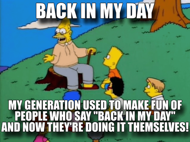 A meme featuring a scene from *The Simpsons* with Grandpa Simpson sitting on a tree stump, holding a cane, and gesturing while speaking to Bart Simpson and other children. The top text reads 'BACK IN MY DAY', and the bottom text states: 'MY GENERATION USED TO MAKE FUN OF PEOPLE WHO SAY "BACK IN MY DAY" AND NOW THEY'RE DOING IT THEMSELVES!'. The meme humorously highlights the irony of a generation that once mocked the phrase 'back in my day' now using it themselves, commenting on generational hypocrisy and the passage of time.