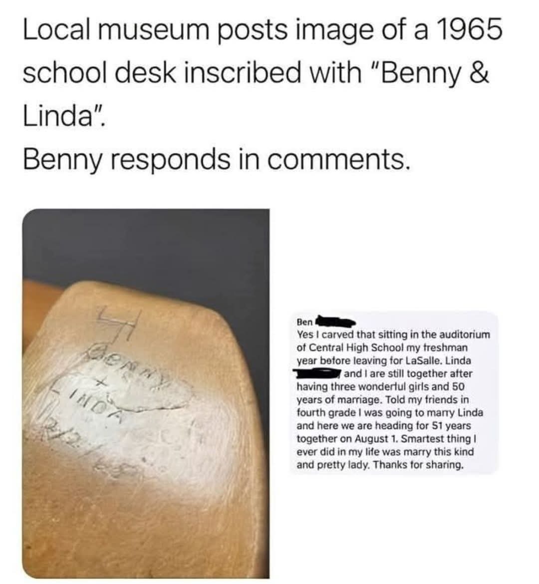 A wholesome social media post screenshot featuring a local museum sharing an image of a 1965 school desk with the carved names 'Benny & Linda'. The top text introduces the context: the museum posted the desk image, and Benny (one of the names carved) responded in the comments. Below the text, there is a photograph of the wooden desk showing the worn, hand-carved inscription 'Benny & Linda' with a small 'X' between the names. To the right of the desk image is a comment from Benny, detailing that he carved the names as a freshman at Central High School before transferring, and he and Linda have been married for 50 years, raising three daughters, with their 51st anniversary approaching. Benny expresses that marrying Linda was the 'smartest thing' he ever did.