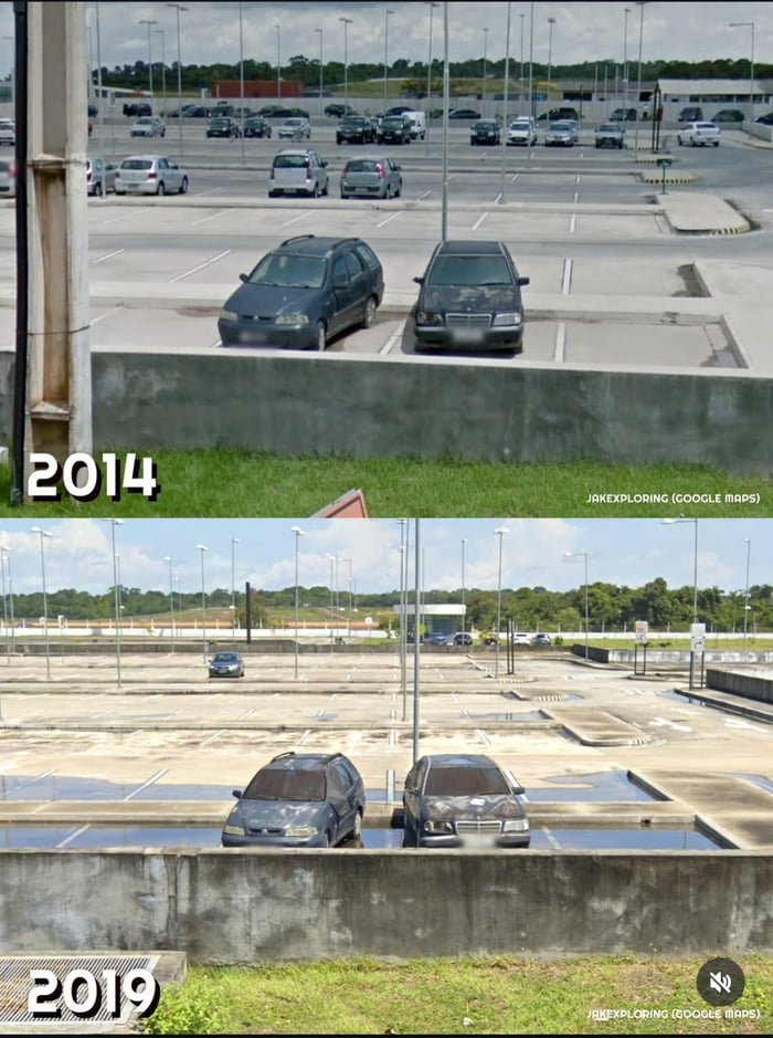 This is a two-panel comparison image showing the exact same two cars in a parking lot, captured via Google Maps in 2014 (top panel) and 2019 (bottom panel). In the 2014 shot, the vehicles are parked in a dry, active parking lot with numerous other cars visible in the background. By 2019, the parking space holding the two cars has flooded, submerging their lower halves, while the rest of the lot appears mostly empty with widespread standing water and puddles. The core humor comes from the absurdity of the cars being completely abandoned in the same spot for 5 years, slowly becoming submerged as the area floods, highlighting how they were forgotten and left to deteriorate in the rising water.