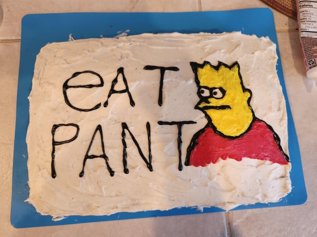 This image shows a homemade rectangular sheet birthday cake with white frosting, resting on a blue plastic cutting board. The cake is decorated with a crudely rendered drawing of Bart Simpson from the animated series *The Simpsons*, wearing his iconic red shirt, with a blank confused expression. Next to the drawing, the text 'EAT PANT' is written in black icing. This is a reference to a popular viral 'cursed' meme of a poorly drawn Bart Simpson with the same nonsensical text, which the uploader's 10 year old daughter specifically requested for her birthday cake.