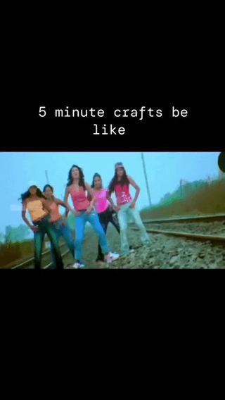 The meme features white text on a black top bar reading '5 minute crafts be like' above a still frame of five young women posing confidently in a synchronized stance directly on active railway tracks, with a foggy roadside background. The joke draws a parallel between the recklessly stupid, impractical, and often dangerous life hacks posted by the popular DIY channel 5 Minute Crafts, and the absurdly unsafe act of standing on train tracks for no logical reason.