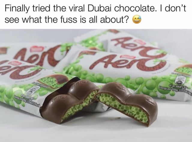 This meme uses sarcasm to mock the viral hype around Dubai's famous filled chocolate bars. The image displays several **Aero mint chocolate bars** (a long-existing product with a bubbly, green mint center), with one bar broken open to show its interior. The caption reads: *"Finally tried the viral Dubai chocolate. I don’t see what the fuss is all about? 😂"*, implying that the trendy Dubai chocolate is just a rebranded or identical version of the well-known Aero bar, making the widespread excitement seem unnecessary.