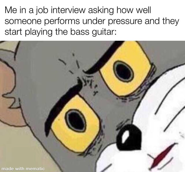 The meme features a close-up screenshot of Tom from the animated series 'Tom and Jerry,' displaying an exaggerated shocked expression with wide yellow eyes, furrowed brows, and tense facial muscles. Above the image is a text overlay: 'Me in a job interview asking how well someone performs under pressure and they start playing the bass guitar:'. The humor stems from the absurdity of the scenario—an unexpected, unrelated action (playing bass guitar) in a professional job interview context—paired with Tom's iconic over-the-top shocked reaction, which comically represents the interviewer's disbelief.