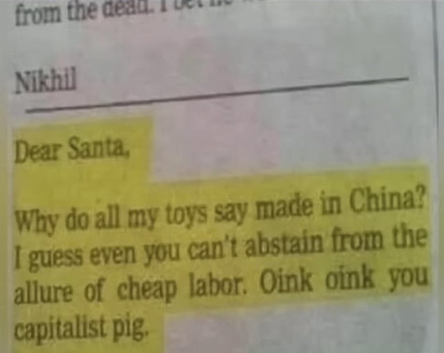 The image depicts a photograph of a handwritten letter on paper, with the name 'Nikhil' written at the top. The main body of the letter, highlighted in yellow, is addressed to Santa Claus and contains sarcastic criticism: 'Dear Santa, Why do all my toys say made in China? I guess even you can't abstain from the allure of cheap labor. Oink oink you capitalist pig.' The letter uses humor and satire to comment on global manufacturing practices and capitalism, framing Santa as complicit in using cheap labor.