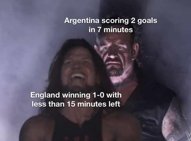 This meme uses a screenshot from a WWE promo featuring two wrestlers: AJ Styles laughing maniacally in the foreground, and The Undertaker staring forward with an intimidating, stoic expression in the background. Text placed above The Undertaker reads "Argentina scoring 2 goals in 7 minutes", while text above AJ Styles reads "England winning 1-0 with less than 15 minutes left". The joke references the 2022 FIFA World Cup quarterfinal match between Argentina and England, where Argentina scored two late goals to overturn a 1-0 England lead and win the match. AJ Styles' laughter represents the overconfidence of England fans when their team was leading late, while The Undertaker's menacing presence represents the sudden, devastating comeback by Argentina that erased England's lead.