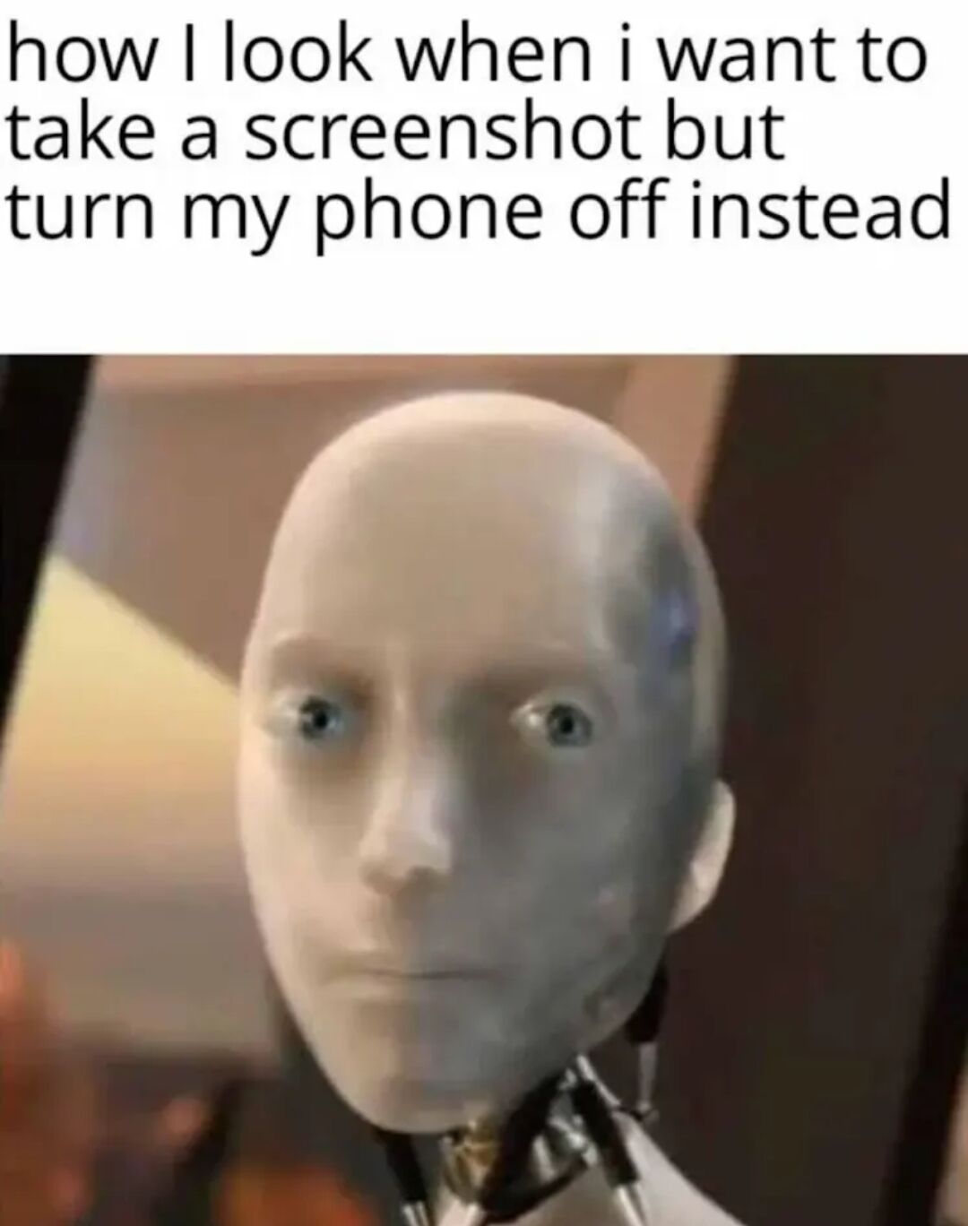 A meme consisting of a top text caption reading 'how I look when i want to take a screenshot but turn my phone off instead' above an image of a white, featureless robot/mannequin head with a blank, slightly confused expression. The humor stems from the relatable scenario of accidentally pressing the wrong phone buttons, with the robot's neutral face humorously depicting the moment of realization.