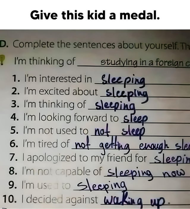 A photograph of a student's completed homework assignment titled 'Complete the sentences about yourself.' The worksheet contains 10 fill-in-the-blank prompts designed to elicit personal responses, but the student humorously subverted expectations by filling most blanks with sleep-related answers. Examples include: 'I'm interested in sleeping,' 'I'm excited about sleeping,' 'I'm tired of not getting enough sleep,' and 'I decided against waking up.' A caption at the top of the image reads 'Give this kid a medal,' praising the student's relatable and witty commitment to the sleep theme.