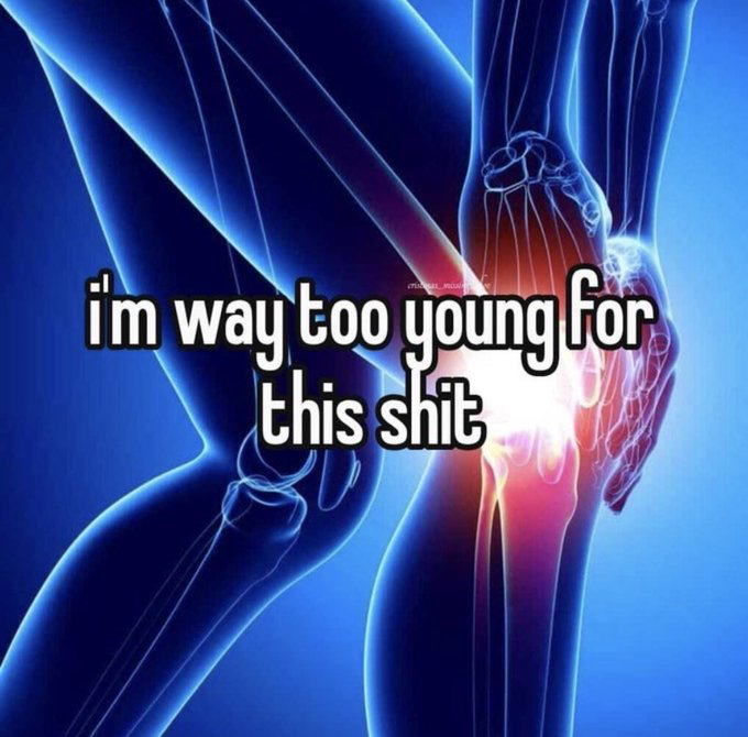 This single-panel reaction meme features a glowing blue 3D medical-style anatomical visualization of a human lower body, with a bright red and white highlighted area indicating severe pain at the knee joint. Bold white text with a black outline is overlaid on the image, reading 'i'm way too young for this shit'. The meme humorously conveys the very relatable frustration of young people experiencing unexpected, age-inappropriate physical discomfort like joint pain, and can also be used metaphorically to express exasperation with overly stressful or unfair situations that someone feels they are too young to be dealing with.