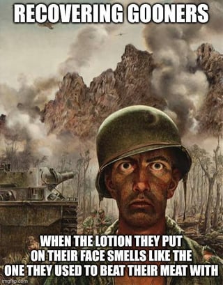 The image depicts a soldier with a serious, intense expression standing in a war-torn landscape featuring mountains, smoke, and a tank. The top text reads 'RECOVERING GOONERS' in bold, uppercase letters, while the bottom text states, 'WHEN THE LOTION THEY PUT ON THEIR FACE SMELLS LIKE THE ONE THEY USED TO BEAT THEIR MEAT WITH'. The humor arises from the contrast between the soldier's grave demeanor and the lighthearted, vulgar premise of mistaking skincare lotion for masturbation lotion, playing on the double meaning of 'lotion' and internet slang ('beat their meat').