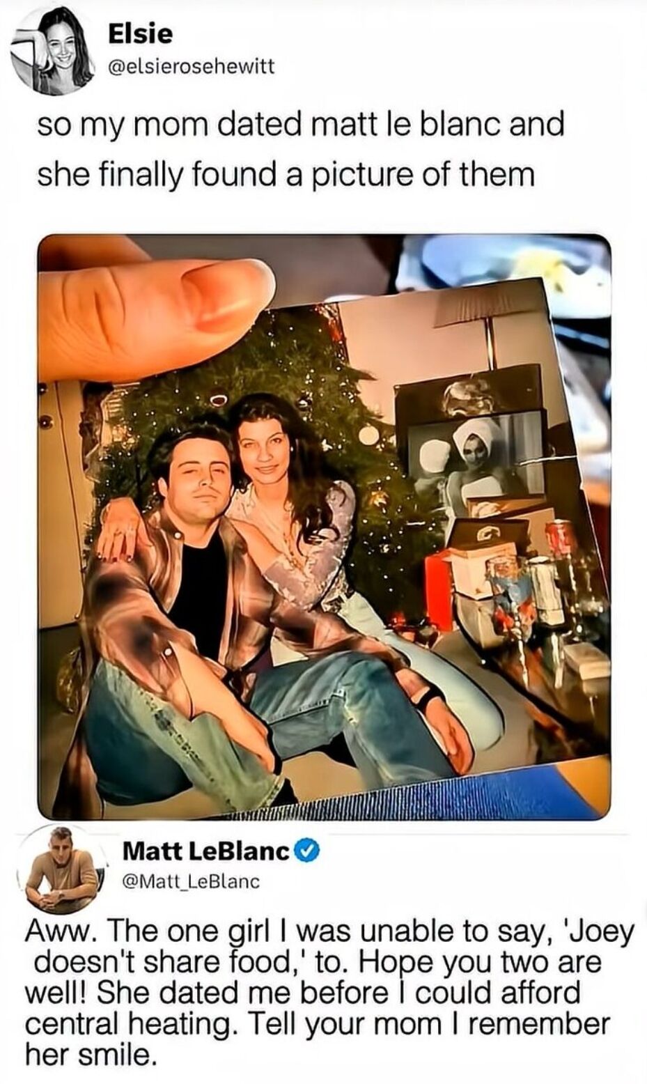 This image is a screenshot of a viral wholesome interaction on X (formerly Twitter). User Elsie Hewitt shares that her mother recently found an old printed photo from when her mom dated actor Matt LeBlanc, who played Joey Tribbiani on the hit sitcom *Friends*. She posts the tweet alongside a photo of the old picture being held up. Verified Matt LeBlanc replies with a sweet, playful message that references Joey's iconic 'Joey doesn't share food' catchphrase, joking that Elsie's mom was the one girl he could never bring himself to say that line to. He adds that their relationship was before he found fame and could afford central heating, says he still remembers her mother's smile, and wishes them both well. The interaction is widely shared as a warm, feel-good celebrity moment.