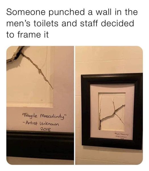 A two-panel meme depicting a humorous and satirical scenario. The left panel shows a cracked wall in a men's toilet with a handwritten label below it that reads: "Fragile Masculinity - Artist Unknown 2018". The right panel shows the same cracked section of the wall now framed like a piece of artwork, mounted on a white tiled wall, preserving the original crack and label. The top text of the meme explains: "Someone punched a wall in the men’s toilets and staff decided to frame it". The joke lies in the staff's creative and witty response to vandalism by recontextualizing the wall crack as a satirical art piece commenting on fragile masculinity.