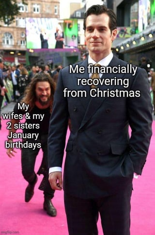 A meme featuring two men on a red carpet. The front man, dressed in a dark suit, has a text overlay reading 'Me financially recovering from Christmas'. Behind him, a long-haired man is chasing, with a text overlay stating 'My wife & my 2 sisters January birthdays'. The image humorously depicts the relatable struggle of trying to recover financially from Christmas expenses only to face additional birthday costs in January.