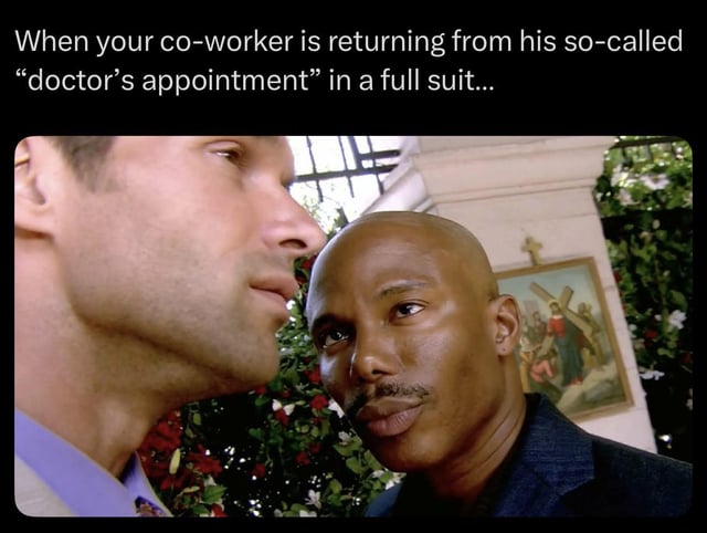 This meme uses a popular reaction still from the 1999 film *The Matrix* to deliver a relatable workplace joke. The text at the top of the image reads: 'When your co-worker is returning from his so-called “doctor’s appointment” in a full suit...' The provided original title acts as the punchline: the doctor the coworker visited is the type that specializes in compensations and benefits, meaning the coworker was actually attending a job interview at another company instead of a real medical appointment. The still shows two men: the man on the left (representing the observing coworker) gives a knowing, skeptical side-eye to the man on the right (representing the coworker returning from his supposed appointment), who looks suspicious and slightly guilty, perfectly capturing the unspoken understanding that the coworker's lie has been caught.