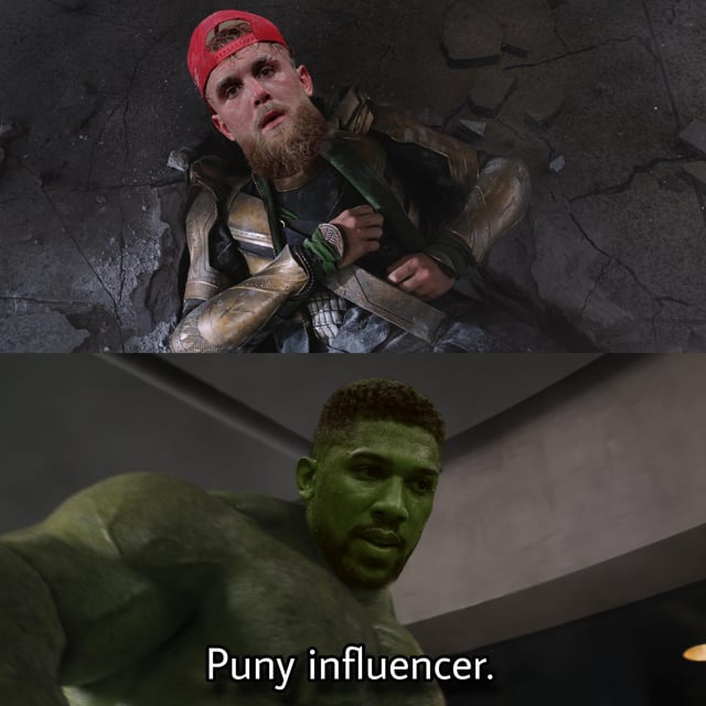 A two-panel meme where the top panel shows a surprised-looking influencer wearing a red cap and gold armor lying on a cracked stone surface. The bottom panel shows a muscular green-skinned character resembling Marvel's Hulk looking down with a serious expression, accompanied by the text 'Puny influencer.' This references the iconic 'Puny god' scene from Marvel's Avengers where Hulk says this to Loki, but replaces 'god' with 'influencer' to mock social media influencers.