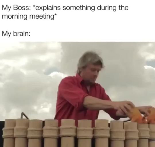 This is a relatable workplace meme consisting of text overlaid above a viral reaction image. The top text reads 'My Boss: *explains something during the morning meeting*', followed by the line 'My brain:'. Below the text is a still image of a middle-aged man in a red shirt standing outdoors under a cloudy sky, methodically lighting a long row of large fireworks one after another. The humor comes from the comparison: while the boss is speaking during a mandatory work meeting, the narrator's brain is completely unengaged with the work content, instead occupied by chaotic, fun, unrelated thoughts represented by the act of setting off a large batch of fireworks.