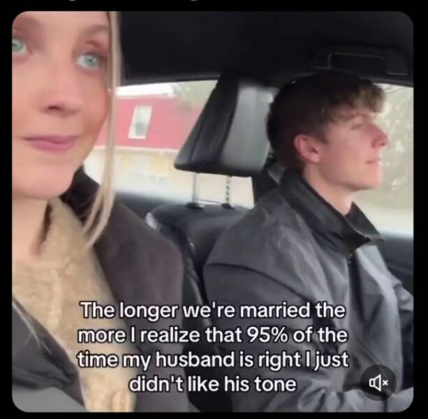 The image depicts a married couple sitting in the front seats of a car, with the woman (wife) on the left and the man (husband) driving on the right. The woman appears to be looking towards the camera with a neutral or slightly amused expression, while the man is focused on driving with a neutral demeanor. Overlaid text on the image reads: 'The longer we're married the more I realize that 95% of the time my husband is right I just didn't like his tone.' This humorous and relatable content highlights a common marriage dynamic where the wife acknowledges her husband's correctness but takes issue with his tone.