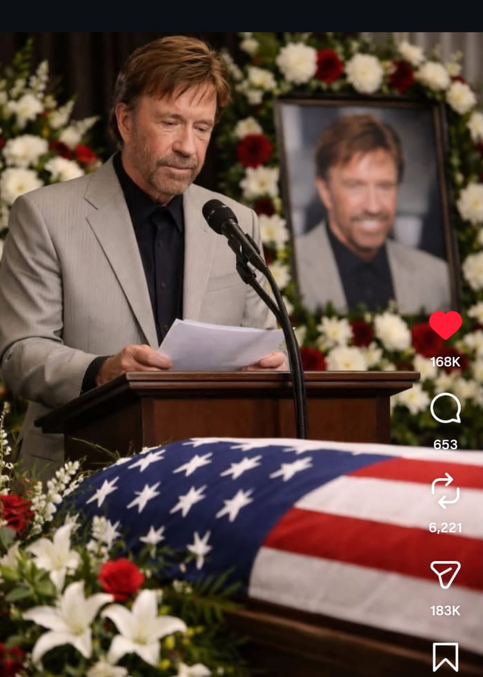 This meme image shows Chuck Norris standing at a podium speaking at a funeral, holding notes in front of a microphone. In front of him is an American flag-draped casket, and behind the casket a framed funeral portrait of Chuck Norris himself is displayed surrounded by funeral flowers. The absurd situation of Chuck Norris giving a eulogy at his own funeral is the punchline, playing on the popular internet "Chuck Norris facts" trope that exaggerates his immortality and invincibility. The image is a screenshot of a social media post, with Instagram-style engagement metrics visible on the right side.