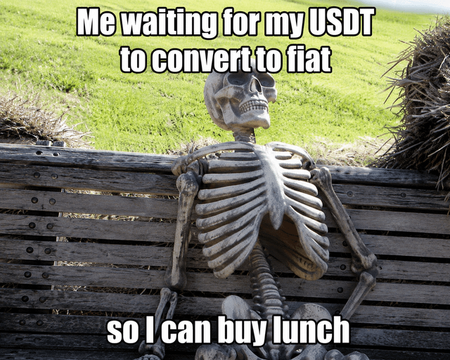 This is a single-panel reaction meme featuring a plastic human skeleton slouched casually against a weathered wooden outdoor bench, set against a background of a green grassy field. Overlaid text at the top reads 'Me waiting for my USDT to convert to fiat', and text at the bottom reads 'so I can buy lunch'. The humor comes from the implication that the process of converting the USDT stablecoin to standard government-issued fiat currency is so slow that the person waiting will die and turn into a skeleton before the conversion completes, even when they just need access to funds for a basic daily purchase like lunch, mocking common frustrations with crypto off-ramping processing times.