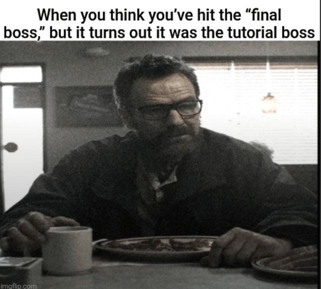 A meme featuring a black-and-white photograph of a real man with a serious, stern expression sitting at a dining table. The man is positioned with his hands resting on the table, in front of a cup and a plate. Above him is a top text overlay that reads: 'When you think you've hit the "final boss," but it turns out it was the tutorial boss.' The image has a watermark 'imgflip.com' in the bottom left corner, indicating it was created using the Imgflip meme generator. The humor stems from the relatable gaming scenario where a perceived major challenge (final boss) is actually trivial (tutorial boss), amplified by the man's serious expression contrasting with the underwhelming realization.