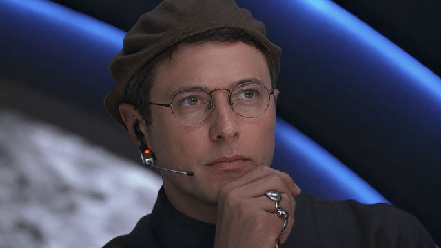 This is a reaction meme using a real photograph of Reddit CEO Steve Huffman (spez) posing thoughtfully with his hand under his chin, wearing a beret, glasses, and a communications headset. The attached caption jokes that Huffman intentionally makes unpopular, user-disliked changes to the Reddit platform's user interface every 10 months, mocking the frequent, widely criticized UI updates rolled out by Reddit leadership that are often perceived as making the platform worse for long-time users.