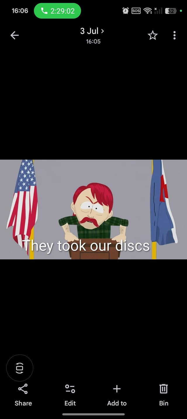 This image is a mobile gallery screenshot of a meme referencing the animated series South Park. The central meme content shows an angry red-haired, mustachioed South Park character leaning over a podium, positioned between a US flag and another regional flag, with overlaid white text reading 'They took our discs'. The surrounding screenshot UI includes an active call timer of 2 hours 29 minutes, date stamp for 3 July at 16:05, and standard mobile gallery controls at the bottom: Share, Edit, Add to, and Bin. The meme parodies South Park's iconic 'They took our jobs' running joke to complain about the phase-out of physical optical media including DVDs, Blu-rays, and video game discs in favor of digital-only distribution, aligning with the original post title 'Discless society'.