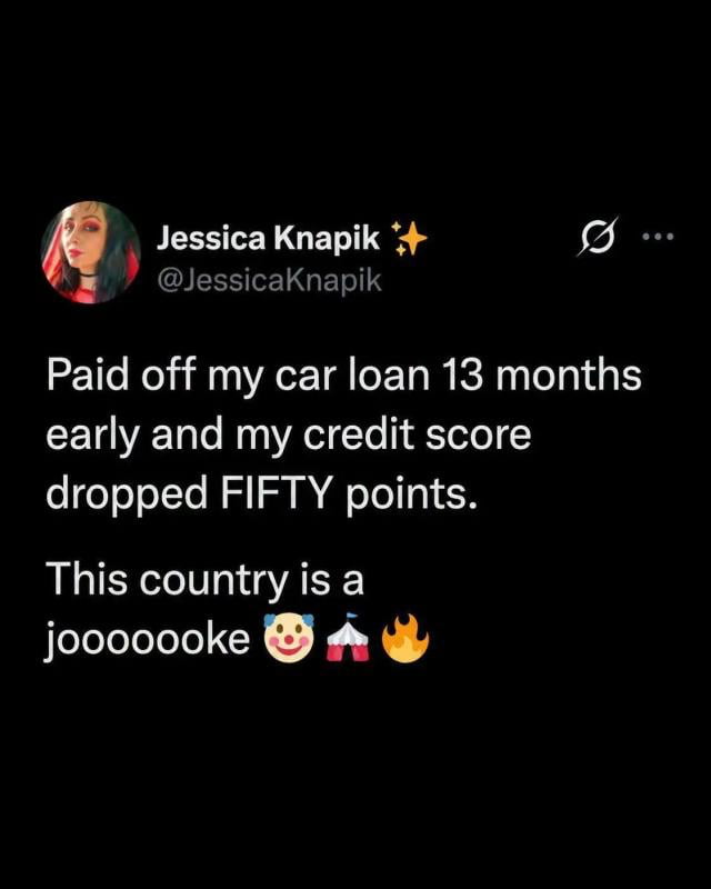 This is a screenshot of a public tweet from X (formerly Twitter) user Jessica Knapik. The tweet states that the user paid off their car loan 13 months ahead of the scheduled repayment period, only to have their credit score drop by 50 points as a result. The user expresses exasperation at this unfair outcome, writing "This country is a joooooooke" alongside clown, circus tent, and fire emojis to convey that the credit scoring system is nonsensical and rigged against responsible borrowers.