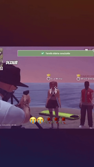 This is a screenshot taken from a Grand Theft Auto Roleplay (GTA RP) server, set on a beach during a purple-hued dusk. A player character with the username DEZAUB on the left is holding a gun aimed at two other player characters standing on the sand in front of the ocean: a female character with pigtails (username Sra Miika, marked with a crown badge indicating premium or moderator status) and a male character in a red jacket. A green UI notification at the top reads "Tarefa diária concluída", which is Portuguese for "Daily task completed". Two crying laughing emojis and three rose emojis are overlaid near the female character, referencing the common recurring "do you speak English?" gag in international GTA RP servers, where players accost others with this question as the start of chaotic, humorous prank or roleplay interactions. The notification implies that confronting the other players is the gun-wielding player's completed daily task.