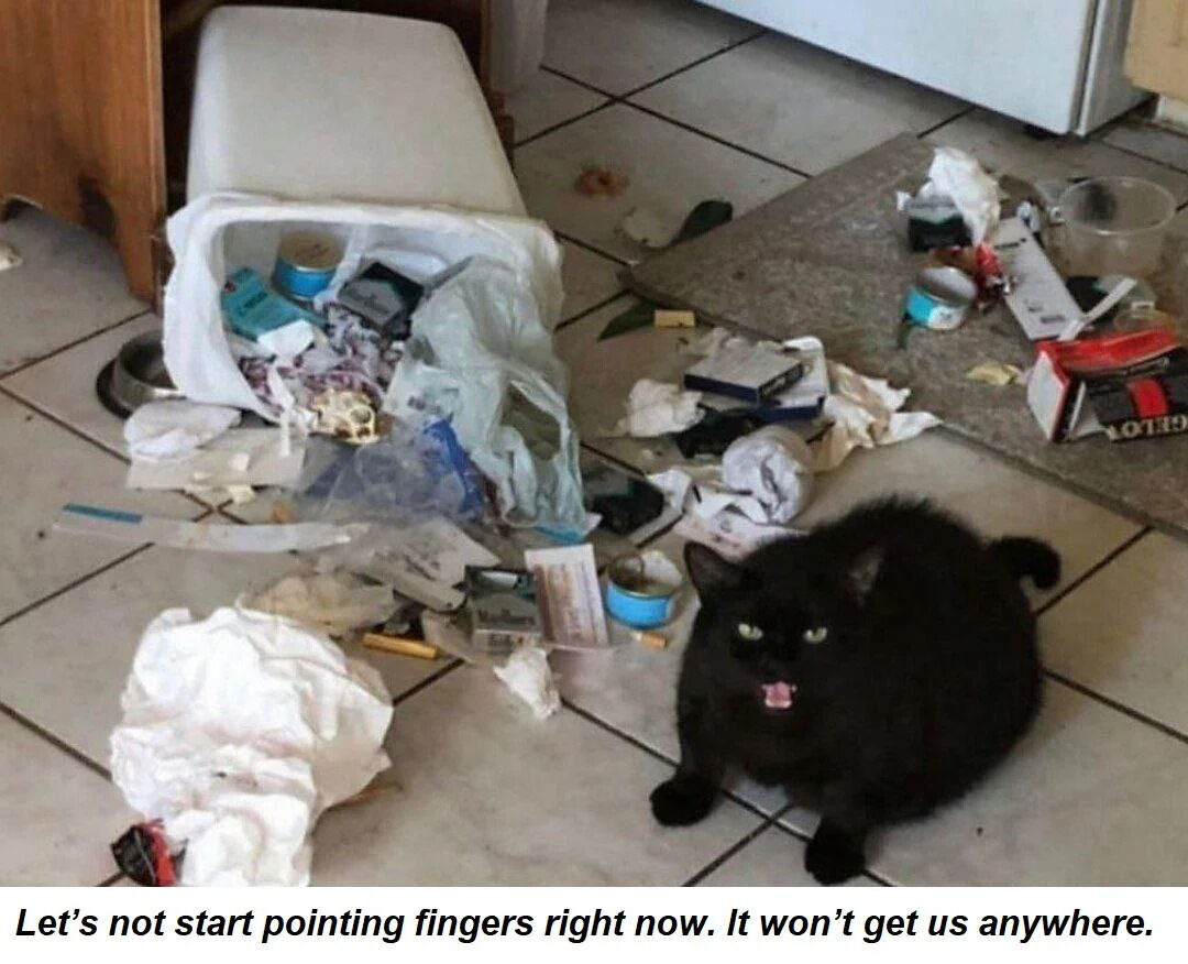 A photograph depicting a cluttered household floor with extensive trash scattered across white tiled flooring. A white trash can is tipped over, spilling its contents—including plastic bags, tissue paper, food containers, and miscellaneous debris—across the area. In the center of the mess sits a small black cat with green eyes, its mouth slightly open as if meowing or reacting to the situation. At the bottom of the image, white text reads: 'Let's not start pointing fingers right now. It won't get us anywhere.' The scene humorously suggests the cat is responsible for the mess but is playfully deflecting blame.