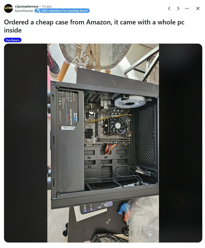 This image is a screenshot of a Reddit post reposted to 9Gag, showing an opened mid-tower PC computer case. The buyer ordered a cheap empty PC case from Amazon, but upon opening the delivery found a full functional PC (including an MSI motherboard, CPU cooler, case fans, and all internal wiring) already installed inside, making this an unexpected lucky surprise for the buyer. There is also a top comment from the original poster referencing the common PC building community meme of mentioning that you run Arch Linux.