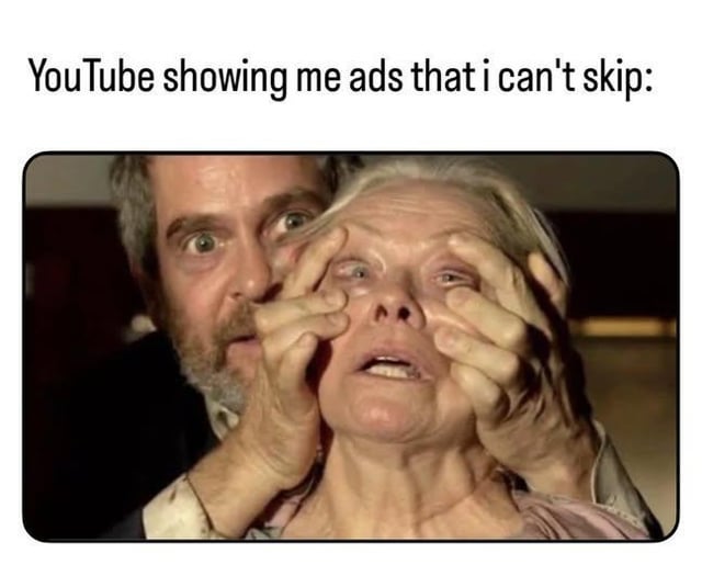 A meme featuring a top text overlay reading 'YouTube showing me ads that i can't skip:' followed by a still image from the 1980 film 'The Shining.' The scene depicts a man forcefully holding open a woman's eyes, with both characters displaying intense emotions—his expression intense and forceful, hers terrified and distressed. The humor lies in the hyperbolic comparison between the frustration of being unable to skip YouTube ads (without Premium) and the visceral, involuntary act of being forced to watch something against one's will, amplifying the relatable annoyance of unskippable advertisements.