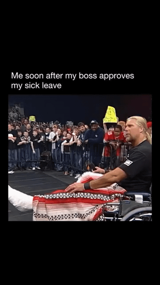 A meme consisting of an image of a man with long blonde hair sitting in a wheelchair, covered with a red and white blanket, positioned in front of a large, enthusiastic crowd. Above the image is the text: 'Me soon after my boss approves my sick leave.' The humor arises from the contrast between the supposed 'sickness' (justifying sick leave) and the man's triumphant, celebratory demeanor in the image, implying he was feigning illness to gain free time.
