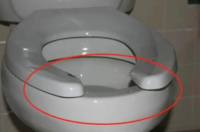 This image shows a close-up of a public toilet seat, with a red circle prominently highlighting the open U-shaped gap at the front of the seat. The accompanying post asks if there is a scientific reason for this gap being designed into public toilet seats. The answer to the posed question is yes: this intentional gap serves multiple practical purposes, including reducing surface area contact for users to lower the risk of germ transmission, making the seat easier to clean for janitorial staff, preventing urine from being caught on the front edge of the seat for male users, and adding structural durability to the seat design.