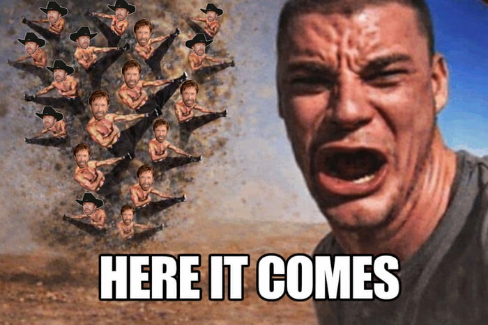 This edited meme features a close-up of a screaming, visibly distressed MMA fighter Nick Diaz on the right side of the image, against an open desert background. On the left, a large swarm of multiple copies of Chuck Norris (all performing a flying high kick, half wearing black cowboy hats) are charging toward Diaz. Large, bold white text with black outline at the bottom reads 'HERE IT COMES', building comedic anticipation for an incoming attack from the endless Chuck Norris clones, playing on the long-running internet meme trend that portrays Chuck Norris as an overwhelmingly unbeatable, superhuman figure.