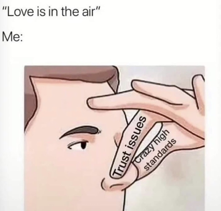 The meme is formatted as a two-part reaction. The top text reads the common romantic phrase 'Love is in the air', followed by the label 'Me:'. Below that, a cartoon illustration of a male character holds his fingers up in a crossed blocking gesture in front of his face. The fingers are explicitly labeled 'Trust issues' and 'Crazy high standards', representing that the viewer is intentionally warding off potential romance due to their personal relationship barriers and high dating expectations. It is a relatable joke for people who are voluntarily single or struggle to pursue romantic connections.