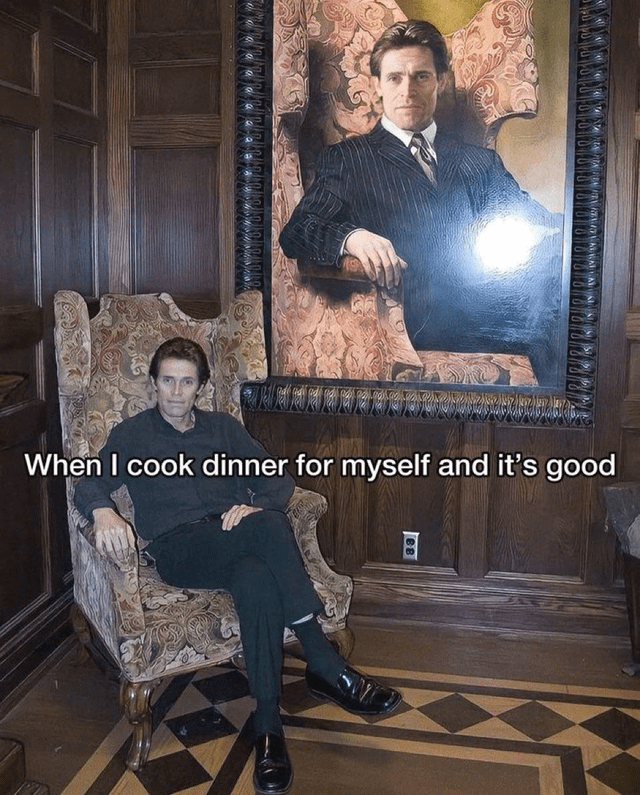 A person sits in an ornate, patterned armchair within a wood-paneled room, with a large portrait of themselves in a formal suit hanging above. The text overlay reads, 'When I cook dinner for myself and it's good,' humorously conveying pride and self-satisfaction from successfully preparing a meal alone.