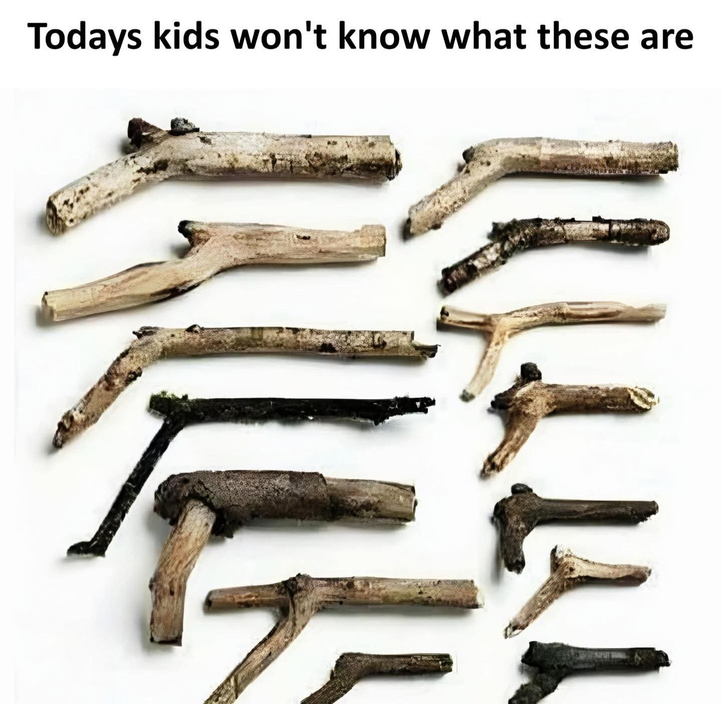 The meme displays 13 naturally forked wooden sticks arranged on a plain white background, each stick is shaped to resemble a crude, improvised toy gun. The text at the top reads 'Todays kids won\'t know what these are' (with a typo missing the apostrophe in 'Todays'). The joke draws on generational nostalgia, referencing the common past childhood practice of using found sticks as pretend weapons for unstructured outdoor play, contrasting this low-tech play experience with the more digital, commercialized play activities common for contemporary children.