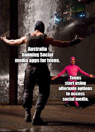 A meme featuring two characters in dramatic poses, with overlaid text satirizing the dynamic between Australia's ban on social media apps for teenagers and teens using alternative methods to access social media. The characters, one in dark clothing and the other in pink, stand with arms outstretched against a backdrop resembling a industrial or dystopian setting, emphasizing the contrast between authority and resistance.
