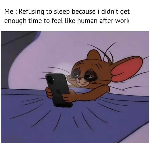 This single-panel relatable meme pairs text at the top with an edited cartoon image to illustrate a common modern work-life frustration. The top text states: 'Me : Refusing to sleep because i didn't get enough time to feel like human after work'. Below the text is a modified frame of Jerry, the mouse from *Tom and Jerry*, tucked into bed under a blue blanket holding a black iPhone. He has exaggerated dark under-eye bags, looks visibly exhausted but still smiles slightly as he browses his phone, perfectly capturing the experience of 'revenge bedtime procrastination', where people sacrifice sleep to carve out personal leisure time after long work days.