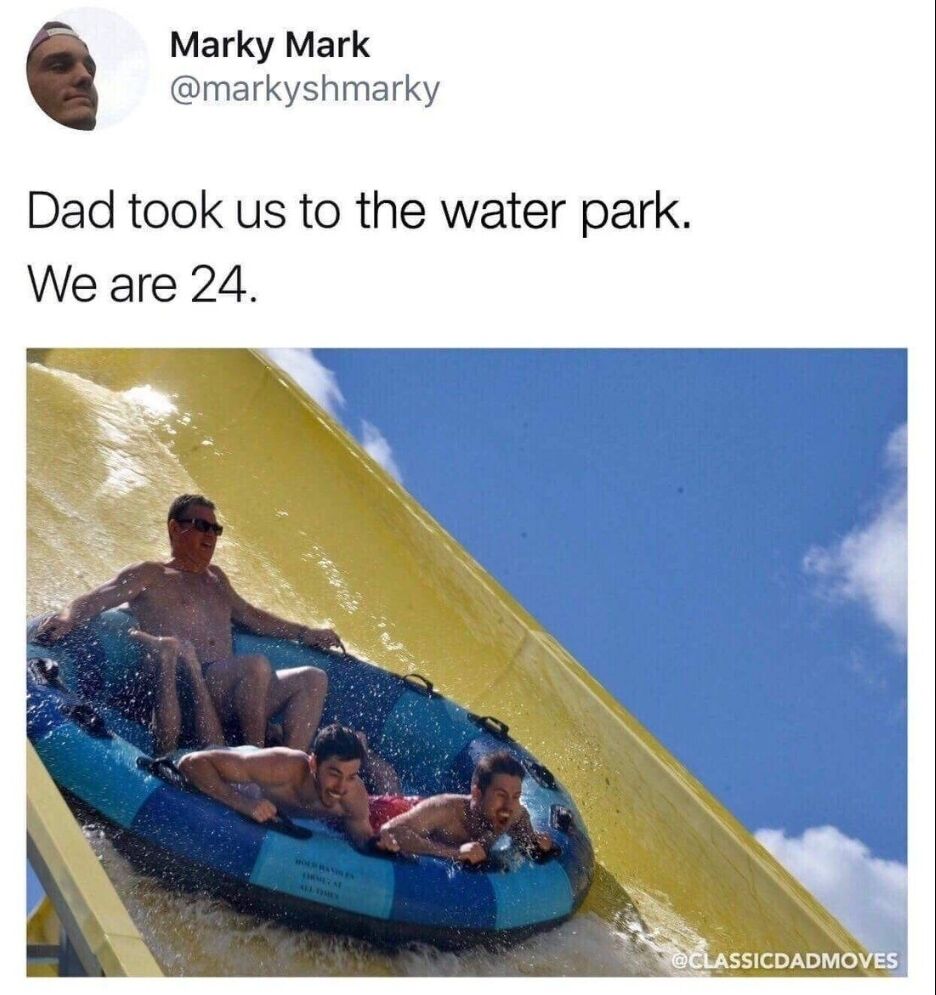 This is a screenshot of a Twitter/X post showing a wholesome relatable meme. The post text reads 'Dad took us to the water park. We are 24.' The attached photo shows a middle-aged dad sitting comfortably in the back of an inflatable raft riding down a large yellow water slide, with his two 24-year-old adult sons lying in front of him on the raft, both excited and enjoying the ride. The humor and heart comes from the sweet contrast of adult children still getting to do fun childhood activities with their dad, highlighting a classic loving dad behavior.