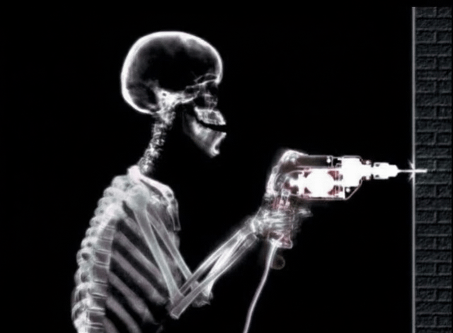 This image is a darkly humorous visual pun presented in an X-ray art style. It depicts a human skeleton holding an electric power drill, actively boring a hole into a brick wall. The core joke is a play on the double meaning of the word 'boring': 1) the physical action of drilling/boring a hole into a surface, and 2) the feeling of being uninterested, lifeless, or 'dying from boredom'. The skeleton reinforces the 'death' aspect of the idiom, turning the common phrase into a literal, absurd visual gag. The stark black background and X-ray rendering make the skeleton and drill stand out, emphasizing the dark, silly humor of the concept.