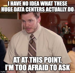 This is a relatable reaction meme using a still of Andy Dwyer, a character played by Chris Pratt from the sitcom Parks and Recreation, who looks awkward and confused. The top overlaid text reads "I HAVE NO IDEA WHAT THESE HUGE DATA CENTERS ACTUALLY DO", and the bottom text reads "AT AT THIS POINT, I'M TOO AFRAID TO ASK". Paired with the original Reddit post title noting the poster still holds strong opinions about data centers despite not understanding them, the meme jokes about the common experience of being too embarrassed to admit ignorance about widespread technical or professional concepts, and the even more common behavior of holding firm opinions on topics one knows very little about.