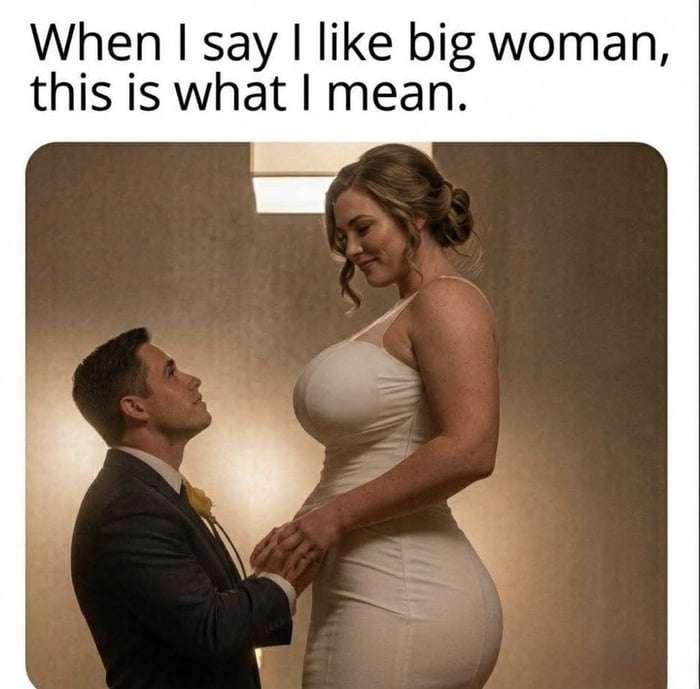 The meme opens with text at the top that reads "When I say I like big woman, this is what I mean." Below the text is an edited photograph: a man in a formal suit kneels, holding hands with a woman in a form-fitting white dress, who has been digitally altered to be far taller and more curvaceous than the man, looking down at him with a soft, affectionate smile. The joke plays on the double meaning of the phrase "big woman", which can refer to plus-size women, and also references the widely known "snu snu" trope from *Futurama*, which describes humorous, desirable intimate encounters with large, strong Amazonian women.