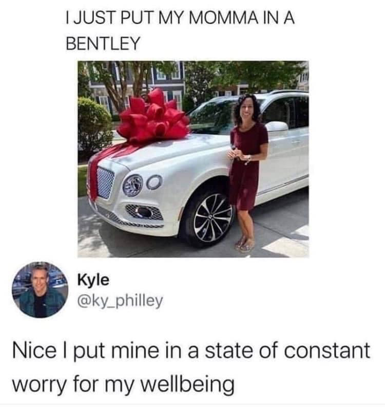 The meme is a screenshot of an X/Twitter thread. The first part shows a post celebrating buying one's mother a new Bentley, accompanied by a photo of a happy woman standing next to the white luxury SUV topped with a giant red gift bow. The reply from user Kyle humorously contrasts this lavish achievement with a relatable, self-deprecating admission that his own mother is only in a state of constant stress over his personal wellbeing, playing on the different ways people interact with and impact their parents' lives.