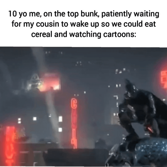 This is a relatable nostalgia meme composed of top text paired with a dramatic pop culture still. The top text describes a common childhood sleepover experience: waiting patiently on a top bunk for a cousin to wake up to eat cereal and watch cartoons. The image below shows Batman from the Batman: Arkham video game series, crouched on a high vantage point over a dark, neon-lit Gotham City in an intensely focused, vigilante waiting pose. The joke stems from juxtaposition: the overly dramatic, serious Batman pose is used to exaggerate how important and intense the mundane experience of waiting for a cousin to wake up for fun activities felt as a 10-year-old, leaning into warm, relatable nostalgia for simple, exciting childhood moments.