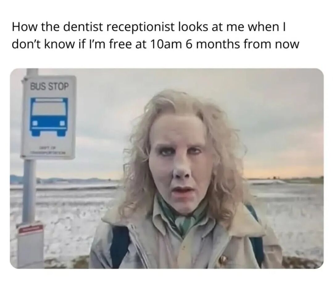 The meme features a top caption and a photograph. The caption humorously describes the scenario: 'How the dentist receptionist looks at me when I don't know if I'm free at 10am 6 months from now'. Below the caption is a photograph of a person with curly blonde hair standing outdoors next to a white bus stop sign (displaying a blue bus icon and the text 'BUS STOP'). The person has a neutral expression with slightly wide eyes, which comically represents the receptionist's probable reaction of mild confusion or exasperation when a patient cannot commit to a far-future appointment time. The background shows a cloudy sky and an open landscape, emphasizing the everyday, relatable setting.