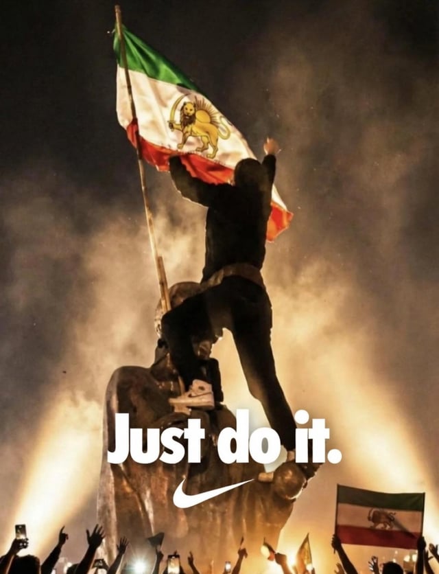 The image depicts a dramatic night scene where a person is climbing a large stone statue, waving a flag featuring a lion emblem (resembling the pre-1979 Iranian national flag). The individual is wearing Nike sneakers, and prominently displayed at the bottom of the image is the Nike slogan 'Just do it.' accompanied by the brand's iconic swoosh logo. The background is filled with smoke, and a crowd of people can be seen below, some holding up phones, suggesting a protest or rally atmosphere. The combination of the protest imagery with Nike's advertising slogan creates a satirical take on the brand's 'Just Do It' campaign.