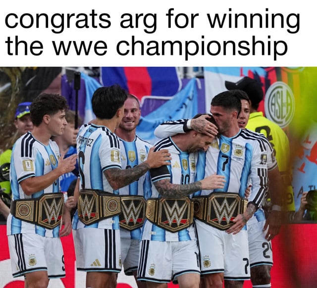This is an edited sports meme using a real photograph of the Argentina men's national football team celebrating their 2022 FIFA World Cup final victory over France. Gold WWE (World Wrestling Entertainment) world championship belts have been digitally edited onto the waists of all visible players, including star player Lionel Messi, who is being embraced by his teammates while appearing emotional. The text placed at the top of the image reads 'congrats arg for winning the wwe championship', making a humorous tongue-in-cheek comparison between the high-drama, hard-fought World Cup win and a pro wrestling championship victory. Argentine flags and other stadium attendees are visible in the background of the celebration scene.